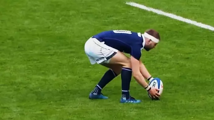 Why do rugby players wear long socks?