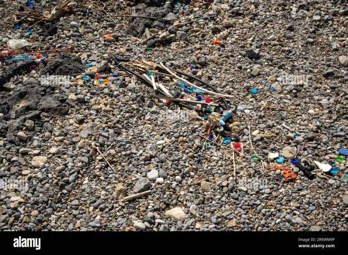 Washed up plastic waste (ocean plastic) on a beach polluting the oceans ... Oceans Awash in Plastic Waste